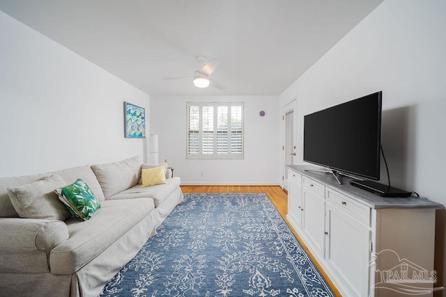 2007 E Gadsden St Unit 105, Pensacola, FL 32501 - living room with light wood-style flooring, a ceiling fan, and baseboards
