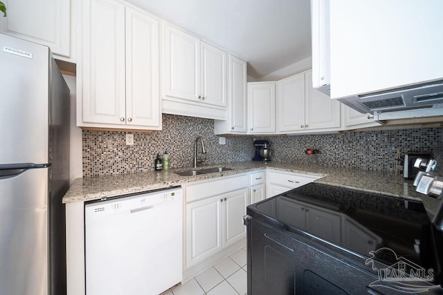 2007 E Gadsden St Unit 105, Pensacola, FL 32501 - kitchen with white dishwasher, freestanding refrigerator, a sink, black / electric stove, and white cabinetry
