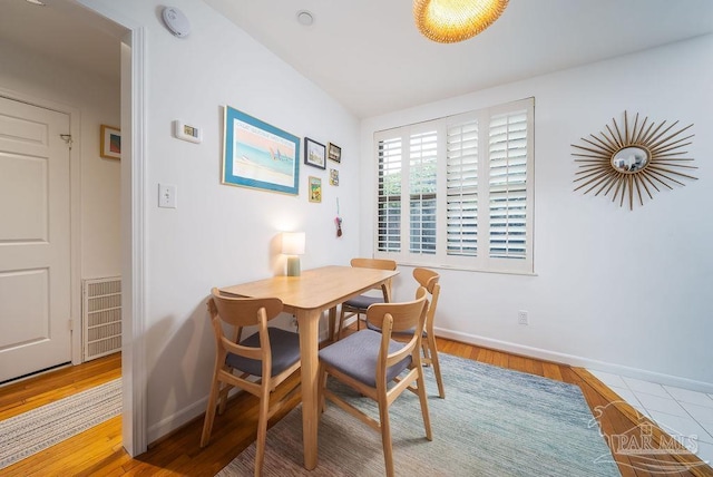 2007 E Gadsden St Unit 105, Pensacola, FL 32501 - dining room featuring baseboards and wood finished floors