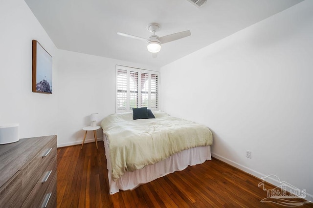 2007 E Gadsden St Unit 105, Pensacola, FL 32501 - bedroom with dark wood-type flooring, baseboards, and ceiling fan