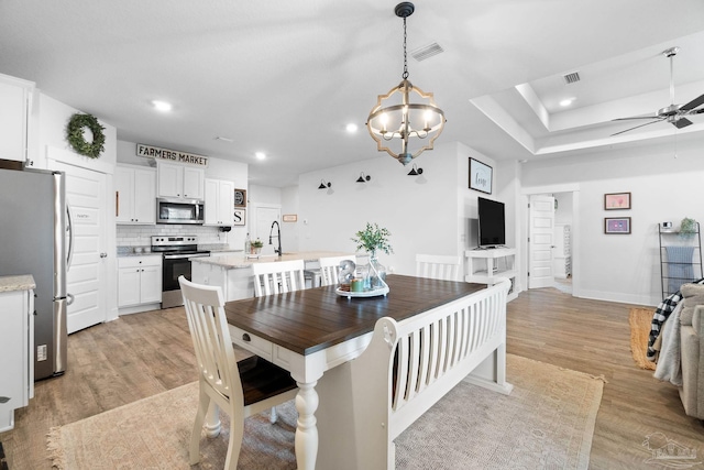 5722 Conley Ct, Pace, FL 32571 - dining space featuring recessed lighting, light wood-type flooring, ceiling fan, a chandelier, and baseboards
