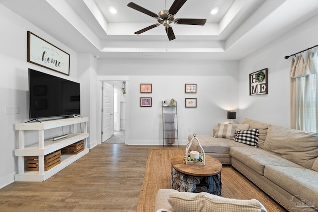 5722 Conley Ct, Pace, FL 32571 - living room featuring a tray ceiling, wood finished floors, ceiling fan, recessed lighting, and baseboards
