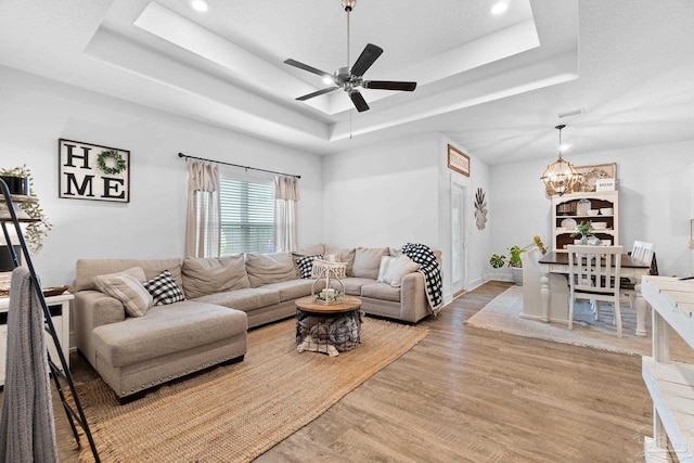 5722 Conley Ct, Pace, FL 32571 - living area with a raised ceiling, a chandelier, light wood-style flooring, ceiling fan, and recessed lighting