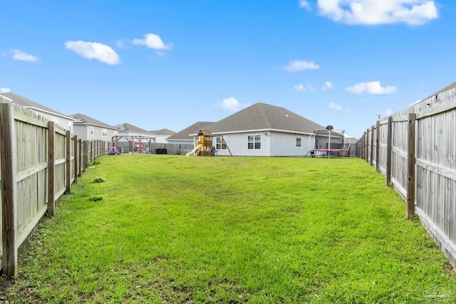 5722 Conley Ct, Pace, FL 32571 - view of yard featuring a trampoline and a playground