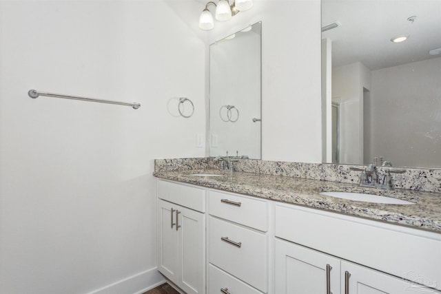 bathroom featuring vanity and hardwood / wood-style floors