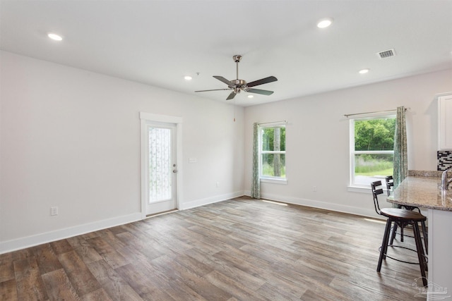 interior space featuring dark hardwood / wood-style flooring and ceiling fan