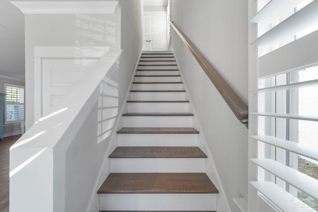 staircase with ornamental molding