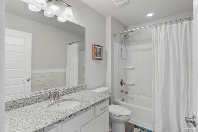 full bathroom with vanity, toilet, and shower / bath combo with shower curtain