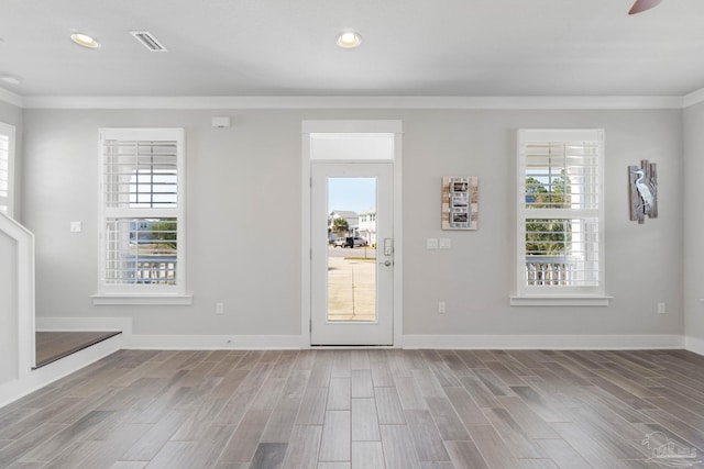 entrance foyer featuring crown molding