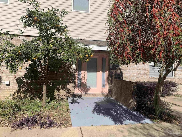 doorway to property featuring a patio area