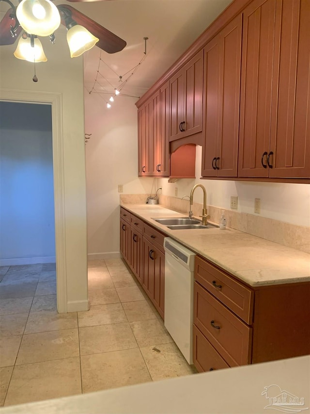 kitchen with dishwasher, sink, and light tile patterned floors