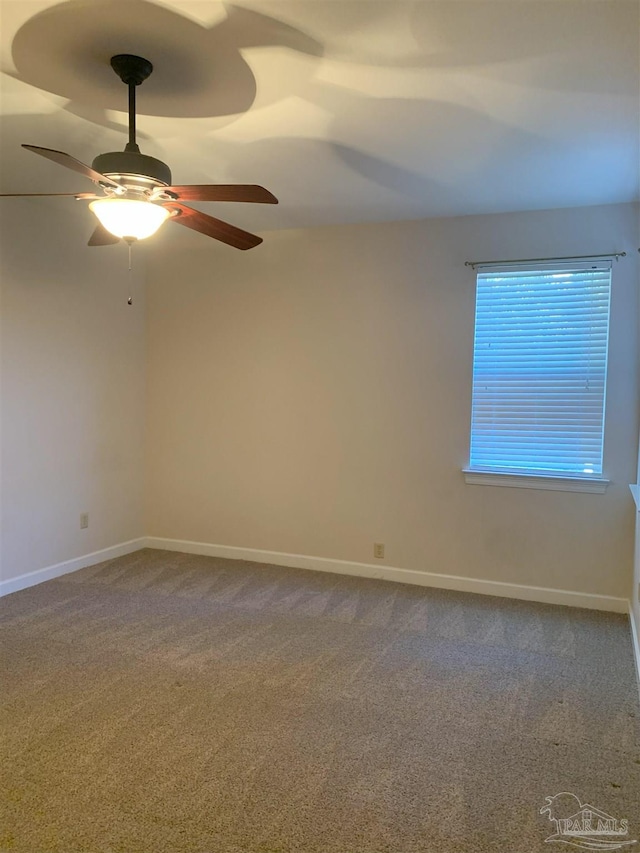 unfurnished room with carpet and ceiling fan