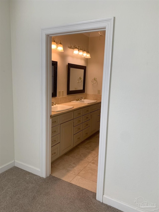 bathroom with tile patterned flooring and vanity