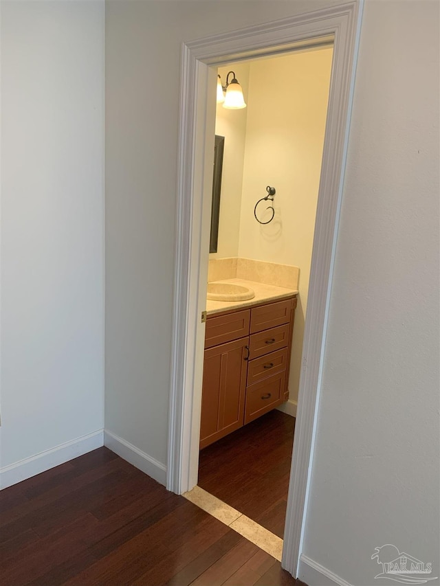 bathroom featuring hardwood / wood-style flooring and vanity