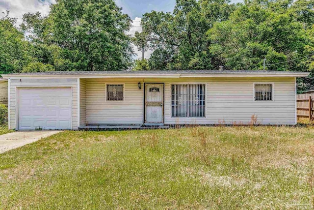 5107 Burlington Ave, Pensacola, FL 32505 - ranch-style house featuring a garage, fence, concrete driveway, and a front yard