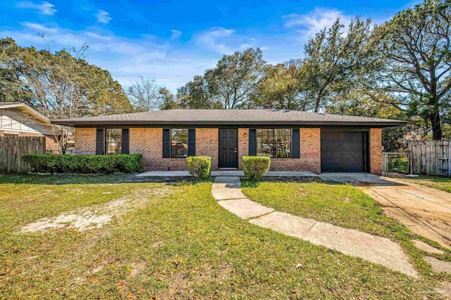 ranch-style house with fence, an attached garage, a front lawn, concrete driveway, and brick siding