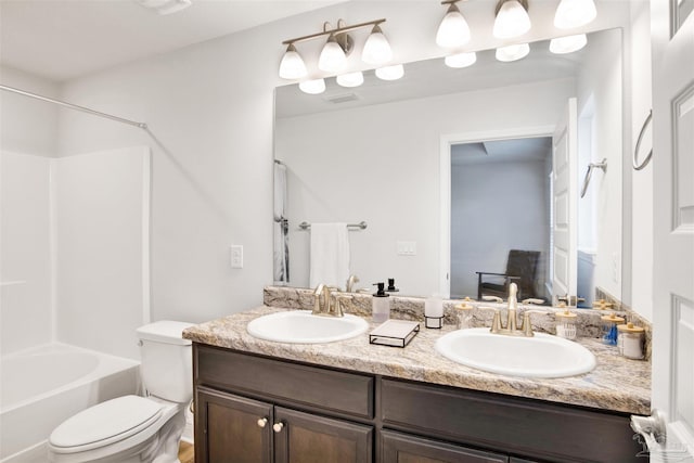 full bathroom featuring shower / washtub combination, vanity, and toilet