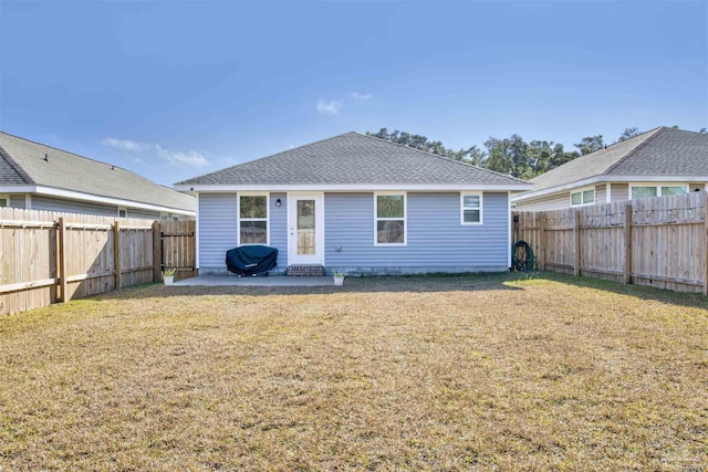 rear view of property with a patio area and a lawn