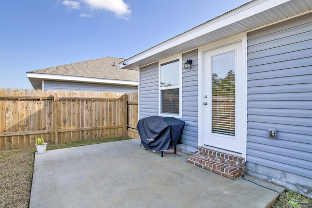 view of patio featuring a grill