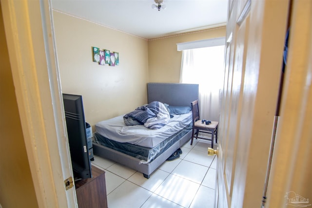 bedroom with light tile patterned floors