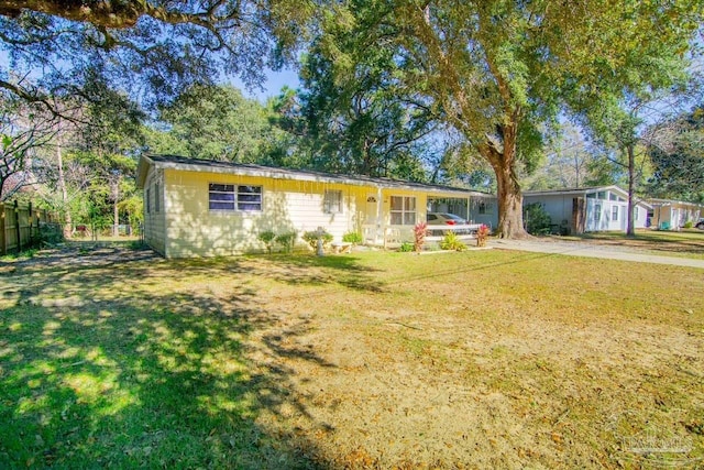 ranch-style home with a front lawn