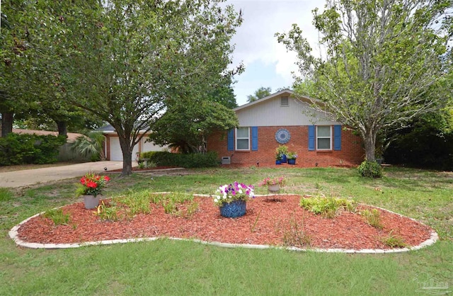 5845 Keystone Rd, Pensacola, FL 32504 - view of front facade featuring brick siding, concrete driveway, a front yard, and an attached garage