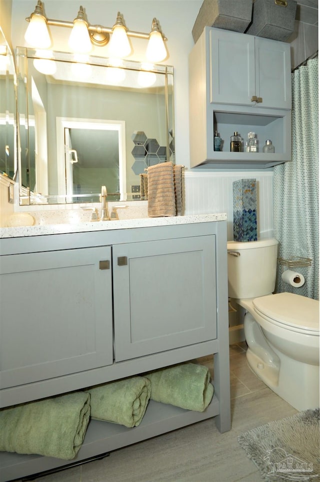 5845 Keystone Rd, Pensacola, FL 32504 - full bath with toilet, vanity, and wood finished floors