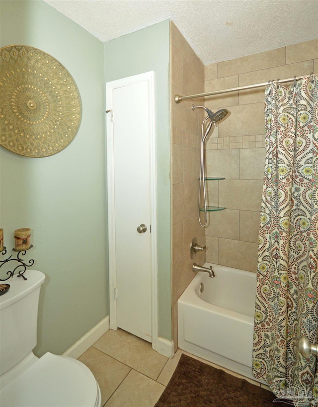 5845 Keystone Rd, Pensacola, FL 32504 - full bath featuring toilet, shower / bath combination with curtain, tile patterned flooring, and a textured ceiling