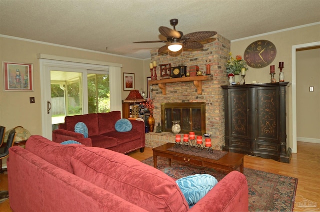 5845 Keystone Rd, Pensacola, FL 32504 - living room with wood finished floors, ceiling fan, crown molding, a textured ceiling, and a brick fireplace