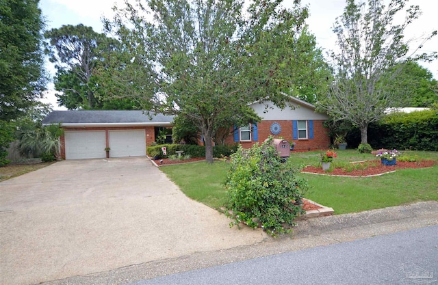 5845 Keystone Rd, Pensacola, FL 32504 - ranch-style home with brick siding, an attached garage, concrete driveway, and a front yard