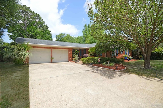 5845 Keystone Rd, Pensacola, FL 32504 - ranch-style house featuring an attached garage, concrete driveway, and brick siding