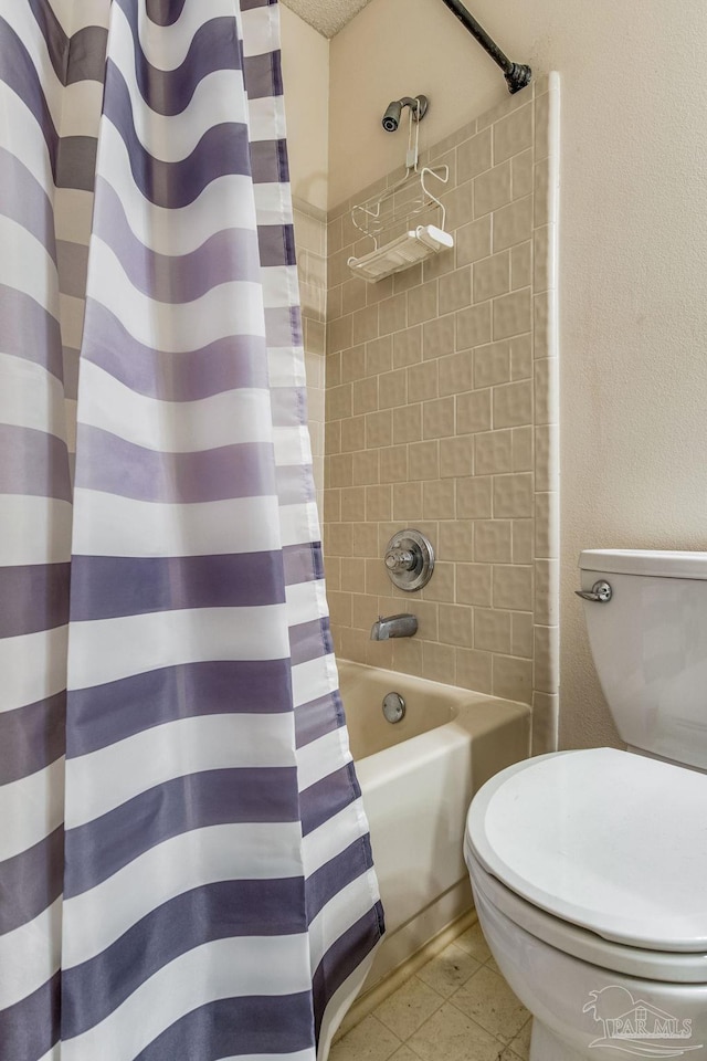 bathroom with shower / tub combo and toilet