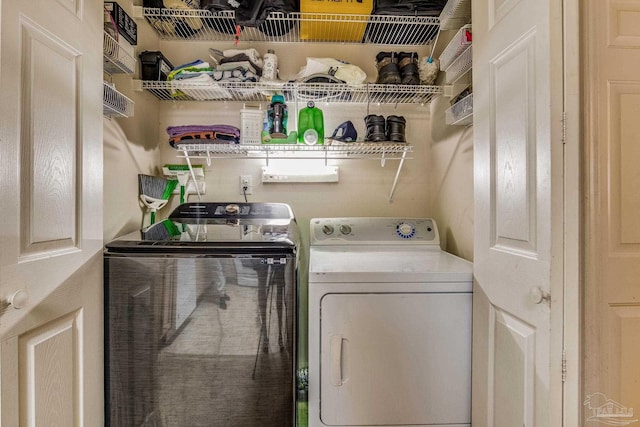 laundry room with separate washer and dryer