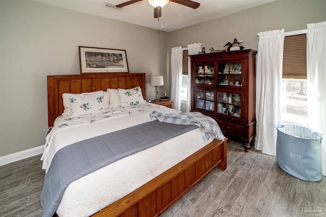 bedroom featuring wood-type flooring and ceiling fan