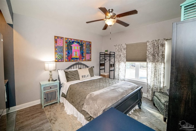 bedroom featuring ceiling fan and dark hardwood / wood-style flooring