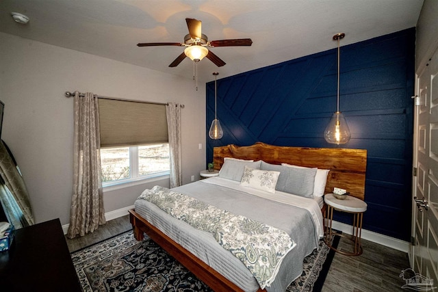 bedroom featuring dark hardwood / wood-style floors and ceiling fan