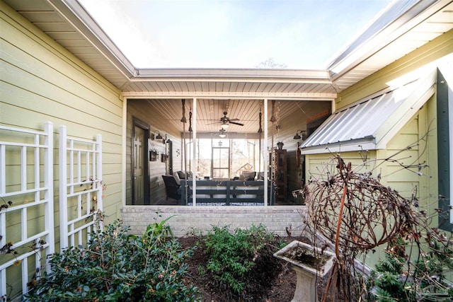 doorway to property featuring ceiling fan