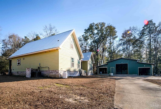 view of side of home with an outbuilding and a garage