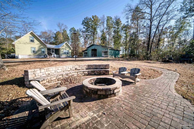 view of patio / terrace with an outdoor fire pit