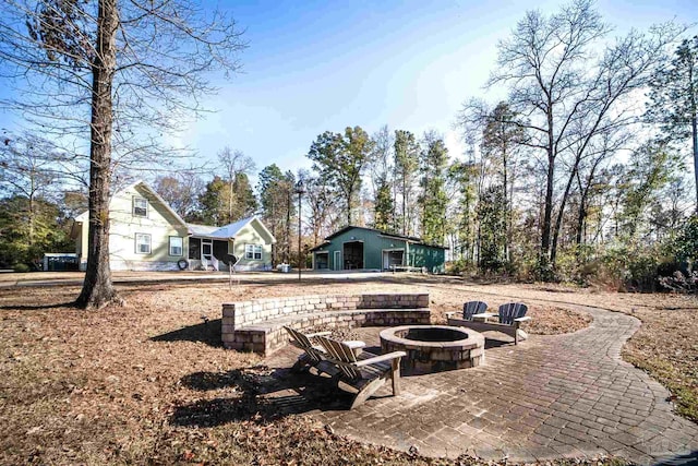 view of patio with a fire pit