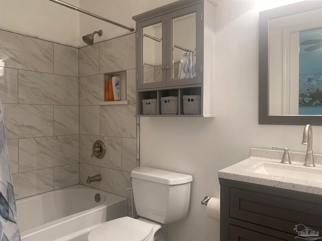 full bathroom with vanity, shower / bath combo with shower curtain, and toilet