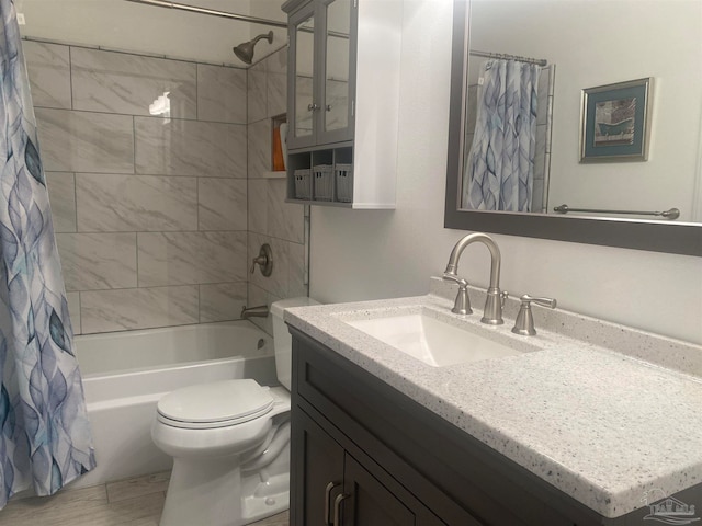 full bathroom featuring vanity, shower / bath combination with curtain, and toilet