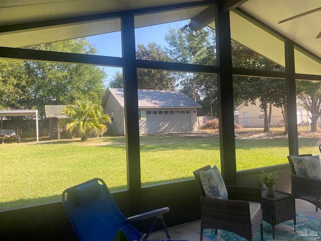 sunroom / solarium with vaulted ceiling with beams and ceiling fan