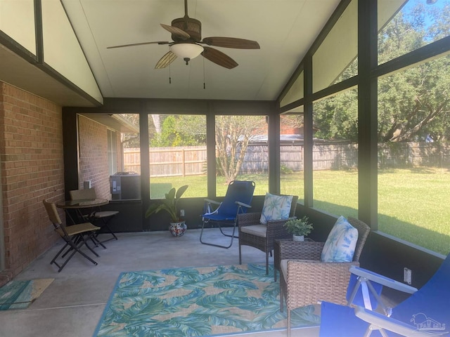 sunroom with vaulted ceiling and ceiling fan