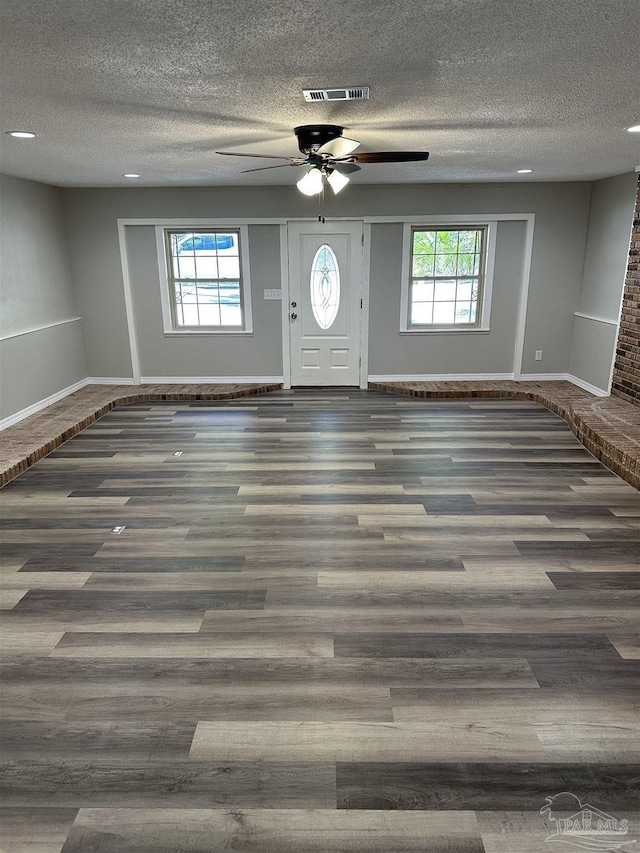 5303 Mikes Pl, Milton, FL 32570 - interior space with visible vents, baseboards, a ceiling fan, and wood finished floors