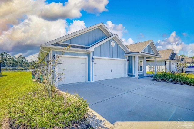 view of front of house with a garage and a front lawn