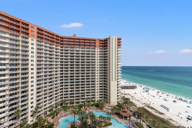 view of property featuring a view of the beach and a water view