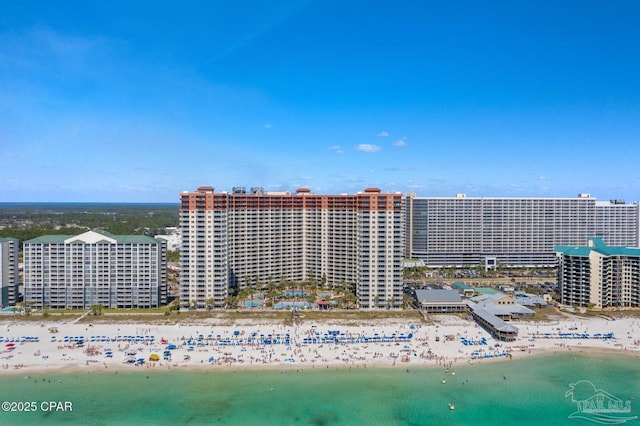 drone / aerial view with a beach view, a water view, and a view of city