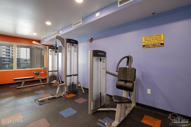 exercise area featuring visible vents and recessed lighting