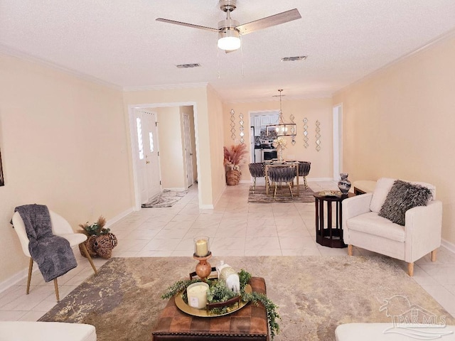 living area with crown molding, visible vents, and a textured ceiling